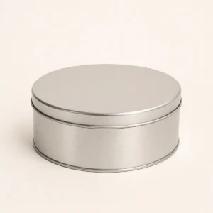 Unbranded classic cookie tin box on a warm gray studio background