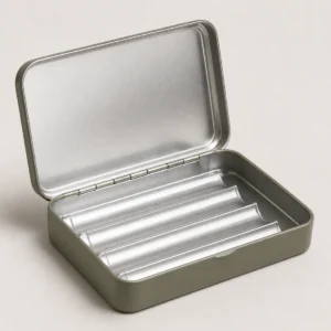 Unbranded pre-rolled cigarettes tin box on a warm gray studio background