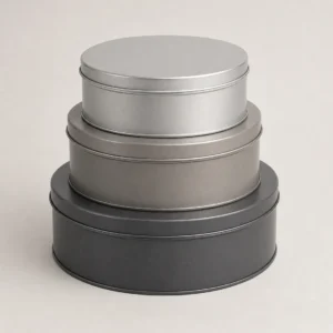 Unbranded stack tin 3-piece set on a warm gray studio background